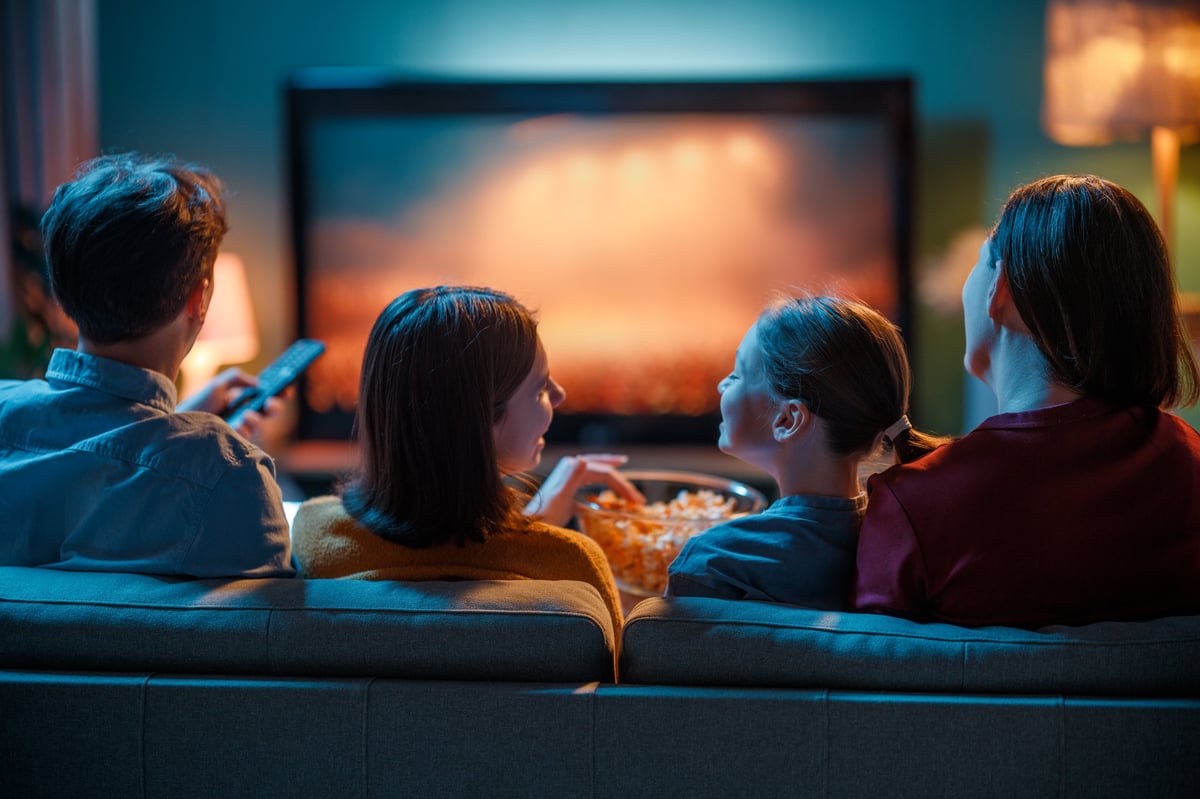 Family enjoying premium TV entertainment together